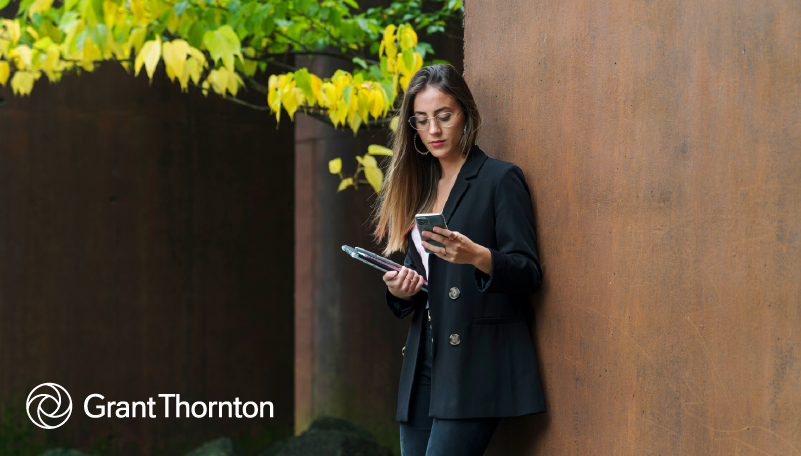 women employee standing with phone